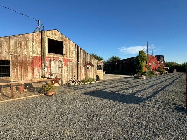 Rustic farm buildings at Ford Family Farms in the evening